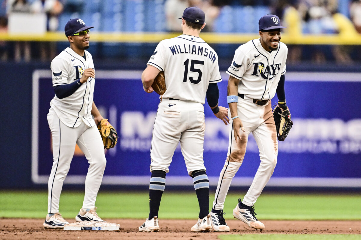 Richie Palacios #1, Ben Williamson #15 and Chandler Simpson #14 of the Tampa Bay Rays celebrate after defeating the Seattle Mariners 6-1 at Tropicana Field in St Petersburg, Florida on July 11, 2026. (Julio Aguilar/Getty Images)