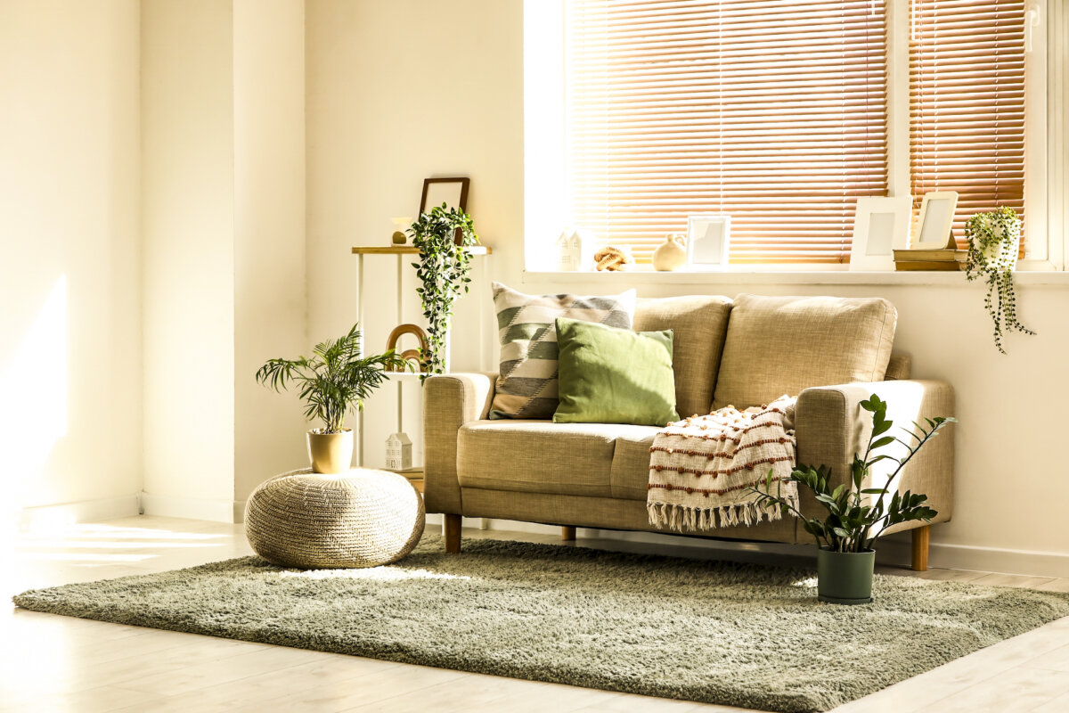 During the hottest part of the day, close blinds, shades, or curtains on windows that receive direct sunlight. South- and west-facing windows are often the biggest offenders. (Pixel-Shot/Shutterstock)
