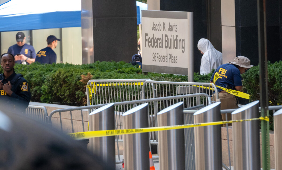 Law enforcement investigate the scene after an incendiary device went off outside of 26 Federal Plaza in Lower Manhattan in New York City on July 20, 2026. (Spencer Platt/Getty Images)