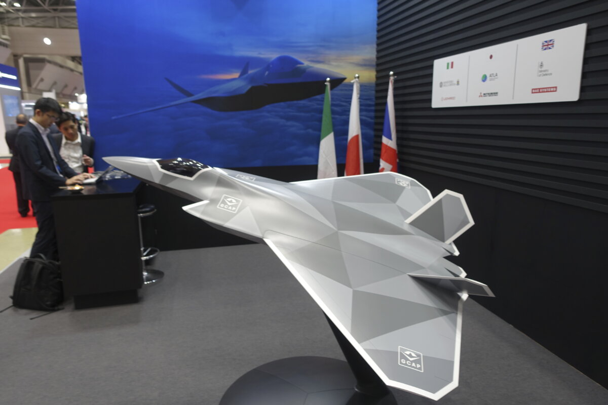 A 1/10 model of a next-generation combat jet is on display at a booth for the Global Combat Air Program at the Japan International Aerospace Exhibition in Tokyo on Oct. 16, 2024. (AP Photo/Mari Yamaguchi)