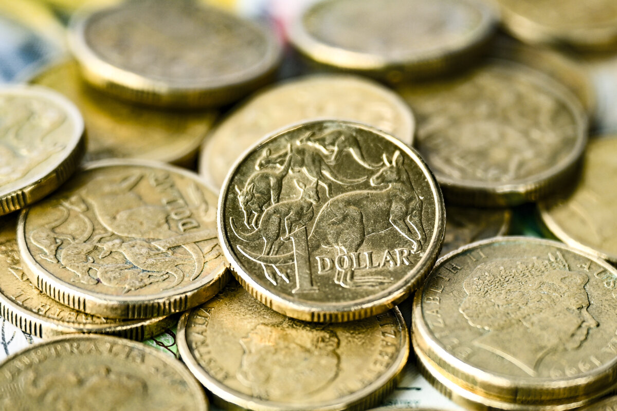 Australian dollar coins and banknotes in Melbourne, Australia on April 4, 2024. (AAP Image/Joel Carrett)