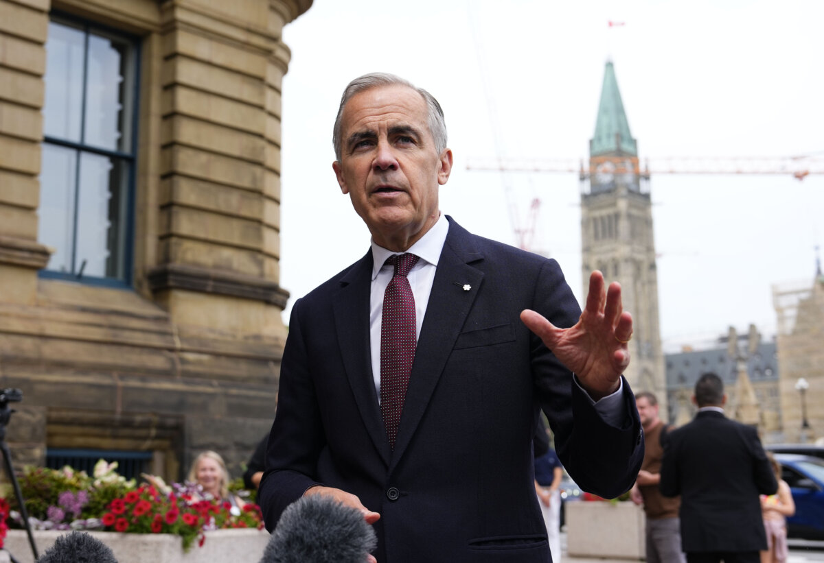 Prime Minister Mark Carney makes a statement outside the Office of the Prime Minister and Privy Council in Ottawa, on July 21, 2026. (The Canadian Press/Justin Tang)