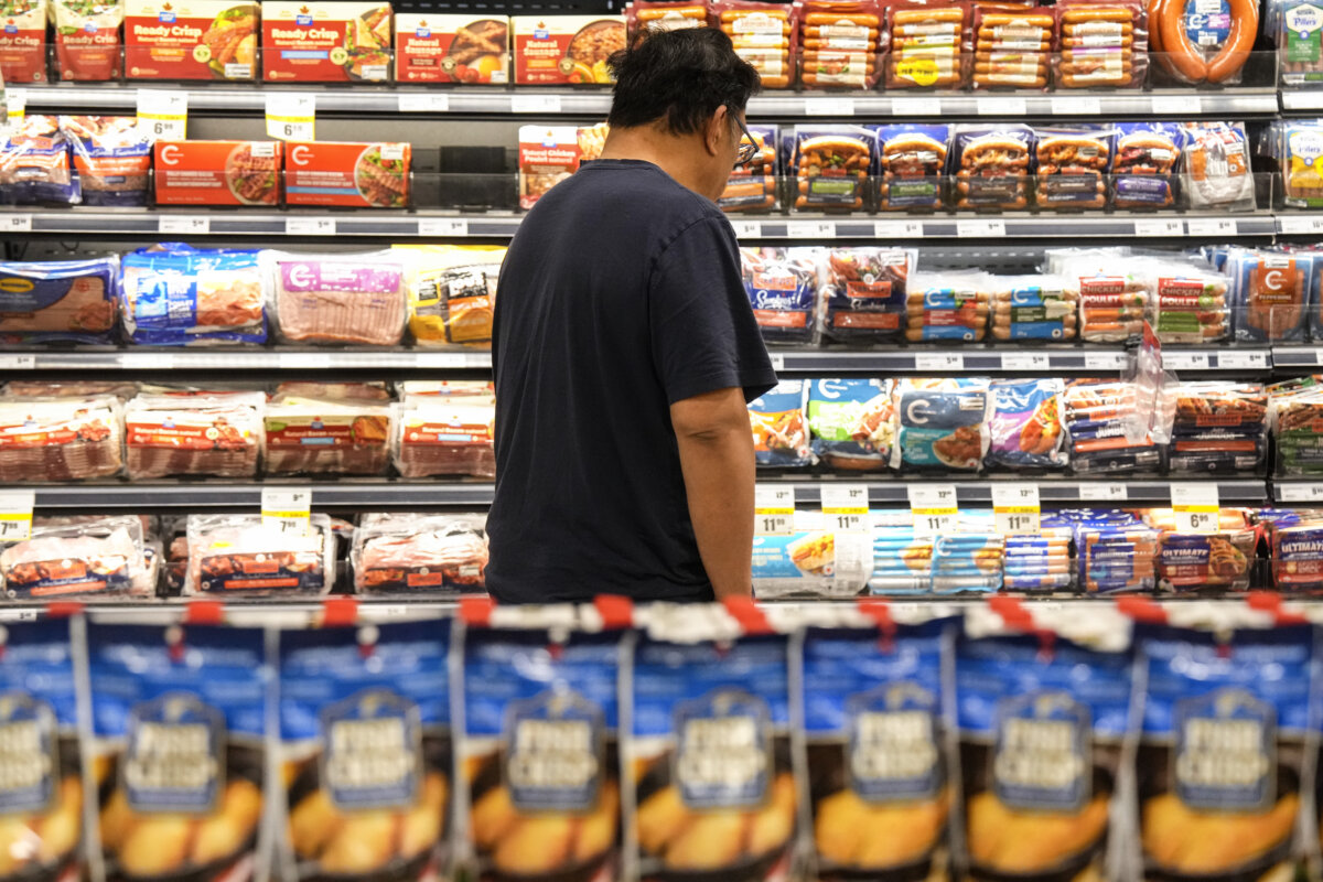 A customer shops for processed meat products at a FreshCo grocery store in Brampton, Ont., on June 5, 2026. (The Canadian Press/Chris Young)