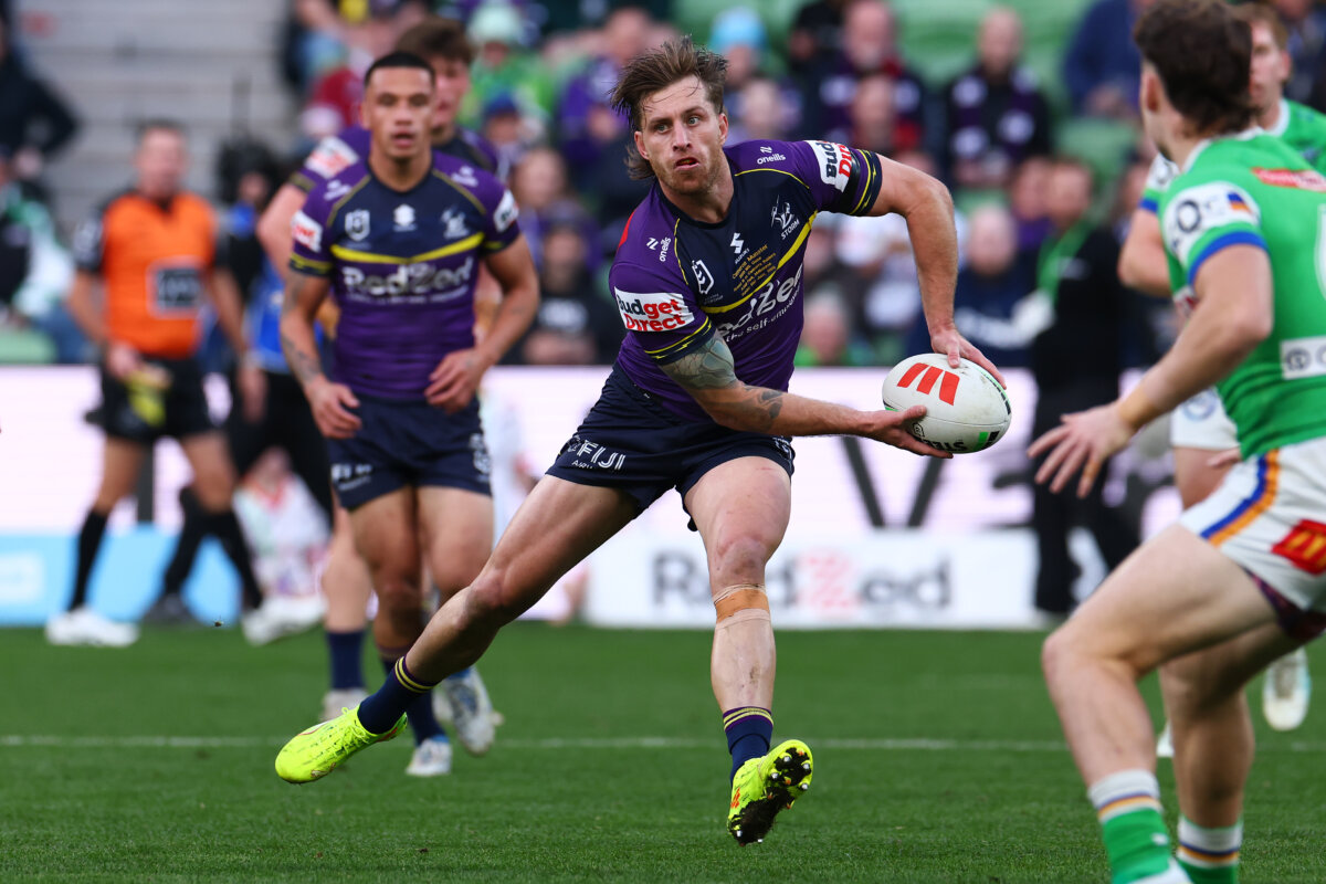 Cameron Munster of the Storm passes the ball during the round 16 NRL match between Melbourne Storm and Canberra Raiders at AAMI Park in Melbourne, Australia, on June 21, 2026. (Daniel Pockett/Getty Images)
