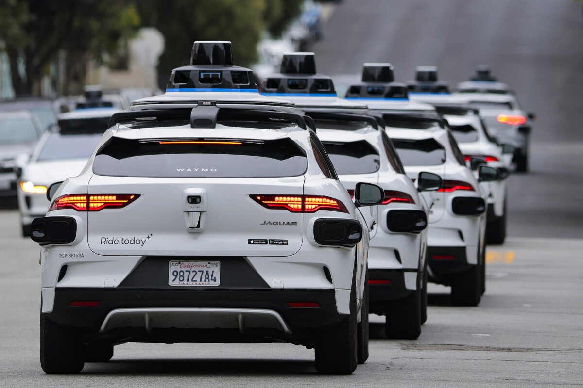 A line of Waymo robotaxis drives through North Beach in San Francisco, Calif., on July 7, 2026. (Heather Diehl/Getty Images)