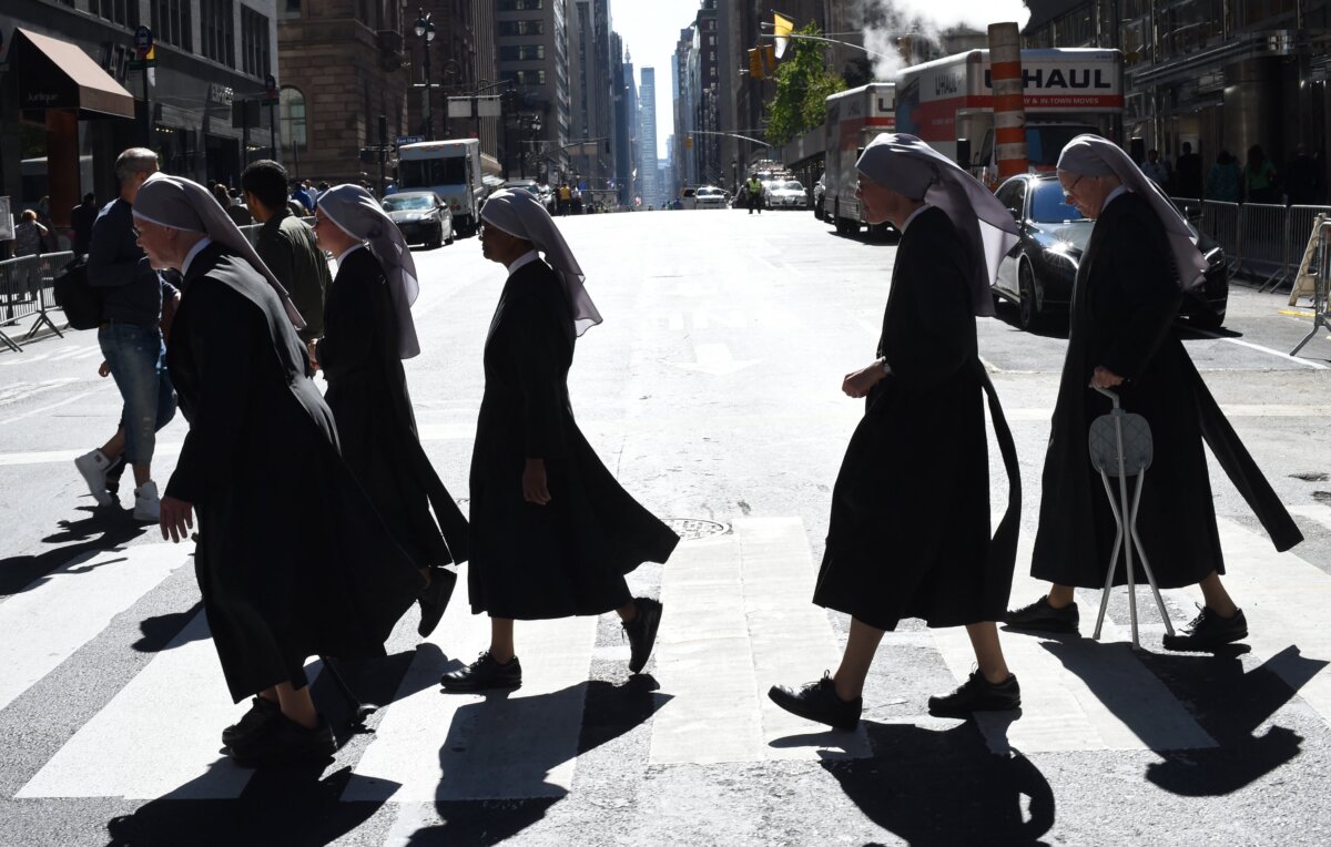 Nuns from the Little Sisters of the Poor cross Madison Avenue in New York City in a file photo. (Timothy A. Clary/AFP via Getty Images)