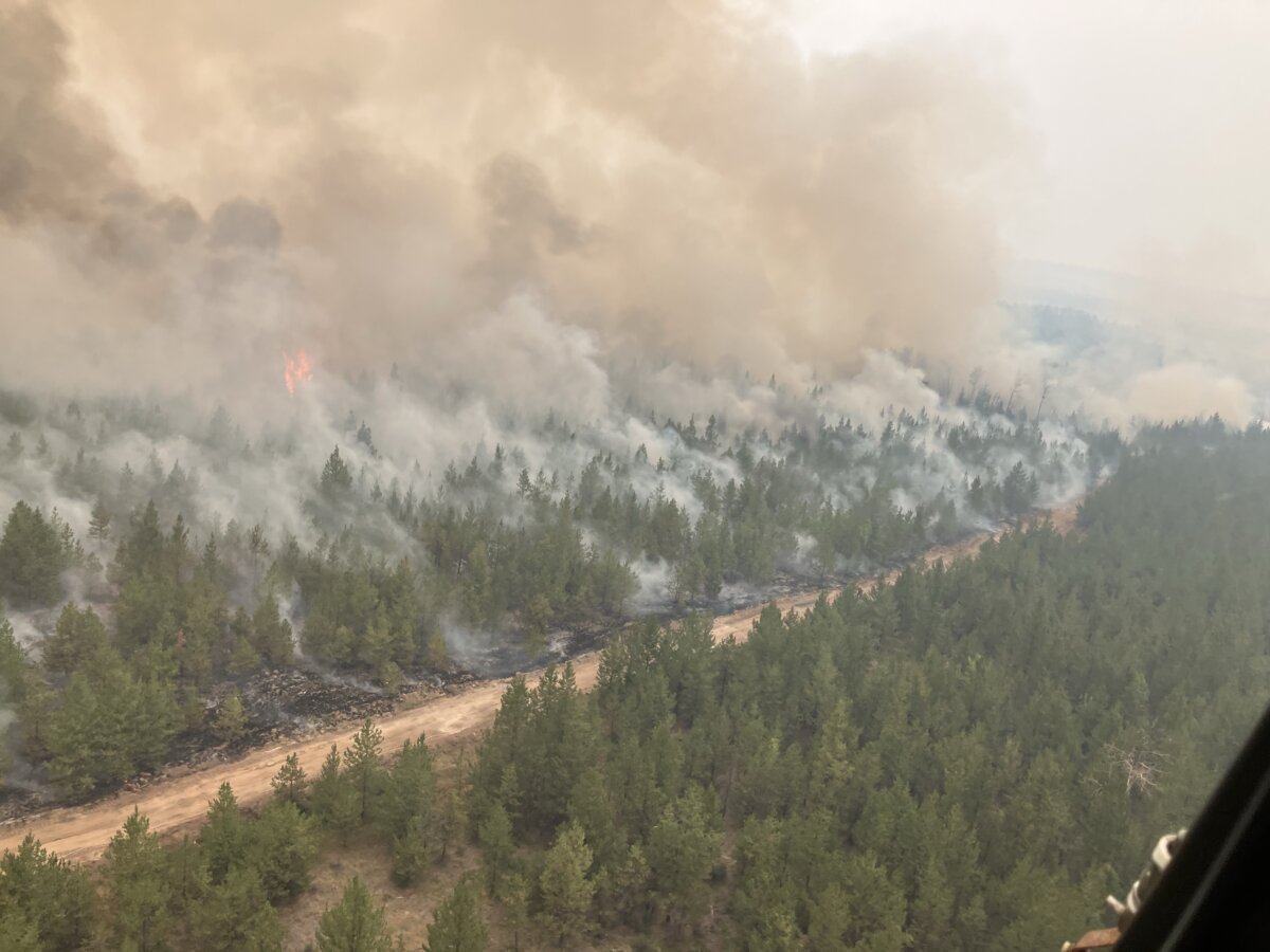 Firefighting crews conduct ignition operations in response to the Fiftynine Creek wildfire northwest of Clinton, B.C., in this handout photo, on July 21, 2026. (The Canadian Press/Handout — BC Wildfire Service)