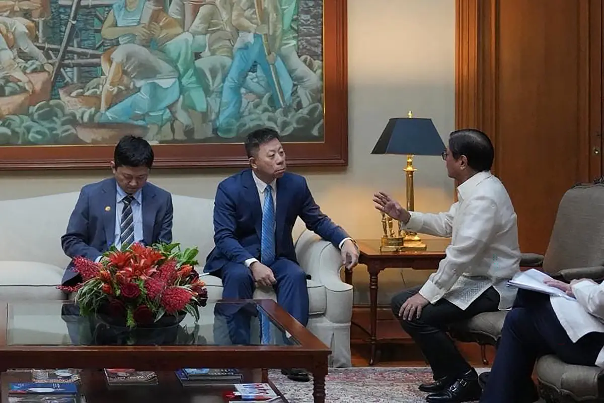 Philippine President Ferdinand Marcos Jr. (R) holds talks with Chinese Ambassador to the Philippines Jing Quan (C) at Malacañang Palace in Manila, on July 21, 2026. The diplomat had been summoned to the presidential palace following a clash between China and the Philippines in disputed South China Sea waters on July 20, which resulted in injuries to two Filipino soldiers. (Philippines' Presidential Communications Office/AFP)