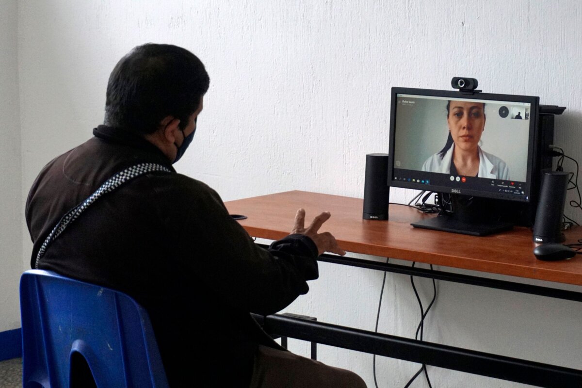 A patient makes a virtual medical consultation at a Respiratory Welfare Center Camp in Guatemala City, on July 23, 2020. (Johan Ordonez/AFP via Getty Images)