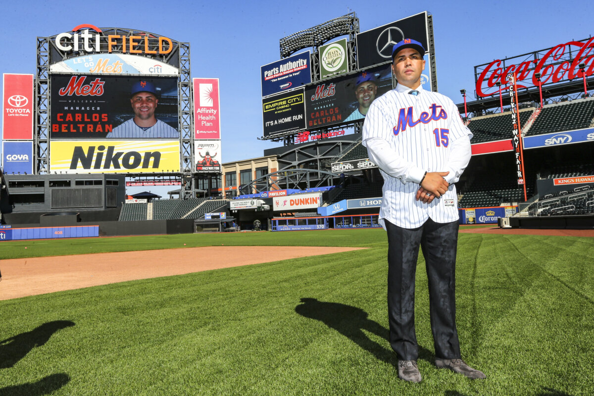 Carlos Beltran poses for pictures after being introduced as the next manager of the New York Mets during a press conference at Citi Field in New York City on November 4, 2019. (Rich Schultz/Getty Images)