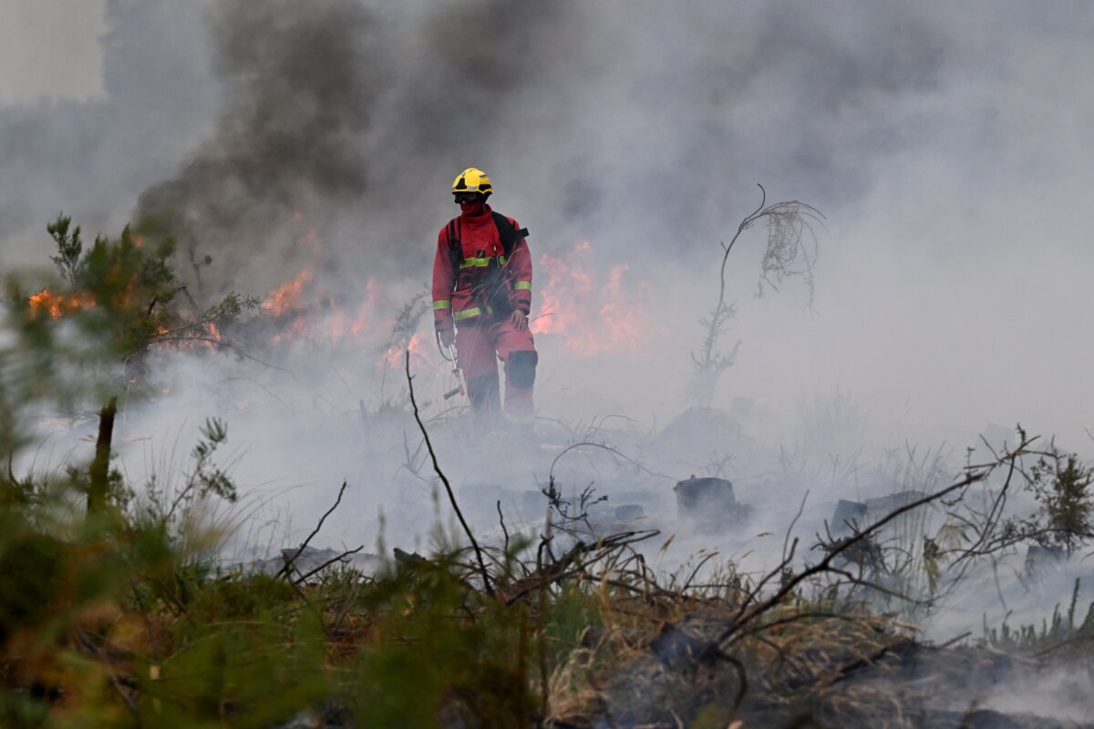 Firefighters battle a wildfire near Marcheprime, outside, Bordeaux, France, on July 26, 2026. (Emma Da Silva/AP Photo)