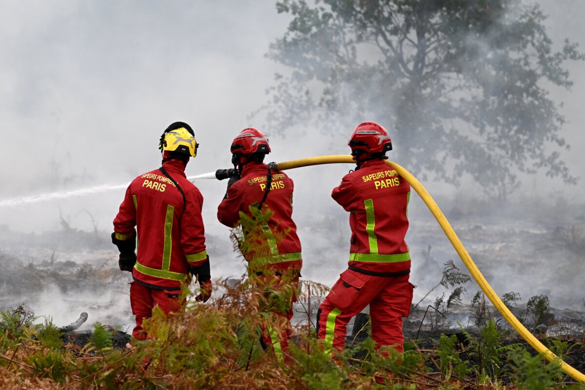 Firefighters from Paris battle a wildfire near Marcheprime, outside, Bordeaux, France, on July 26, 2026. (Emma Da Silva /AP Photo)