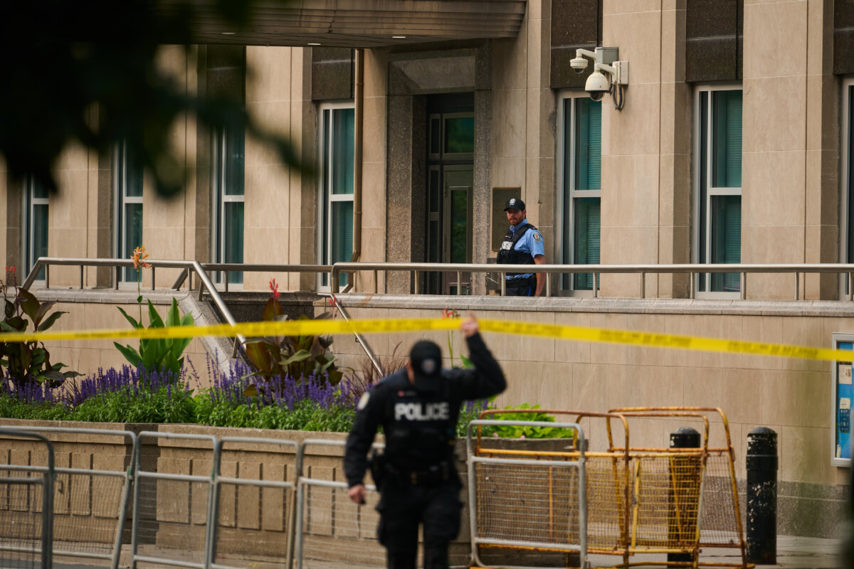 Police work the scene of an early morning shooting outside the U.S. Consulate in Toronto on July 27, 2026. (The Canadian Press/Sammy Kogan)