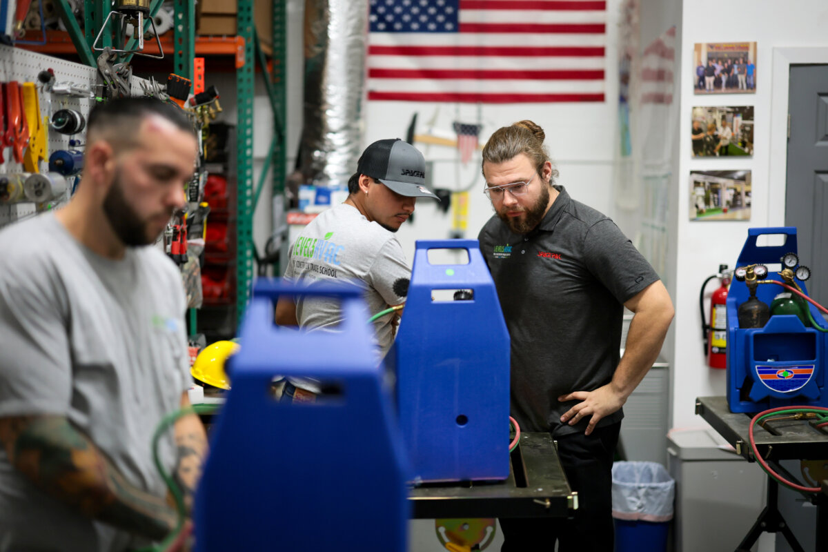 An instructor teaches a student about brazing—a metal joining process used in heating, ventilation, and air conditioning systems—at a construction trade school in Homestead, Fla., on May 9, 2026. (Joe Raedle/Getty Images)