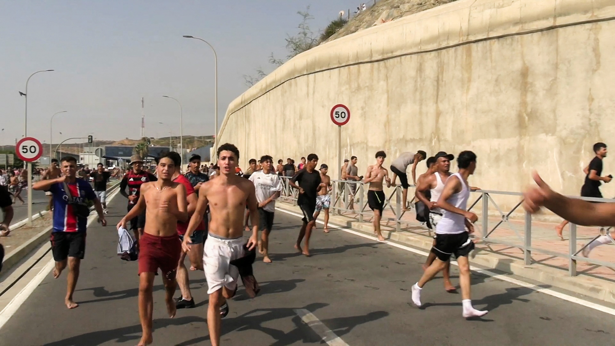 Migrants cross on foot into North African enclave of Ceuta from Morocco