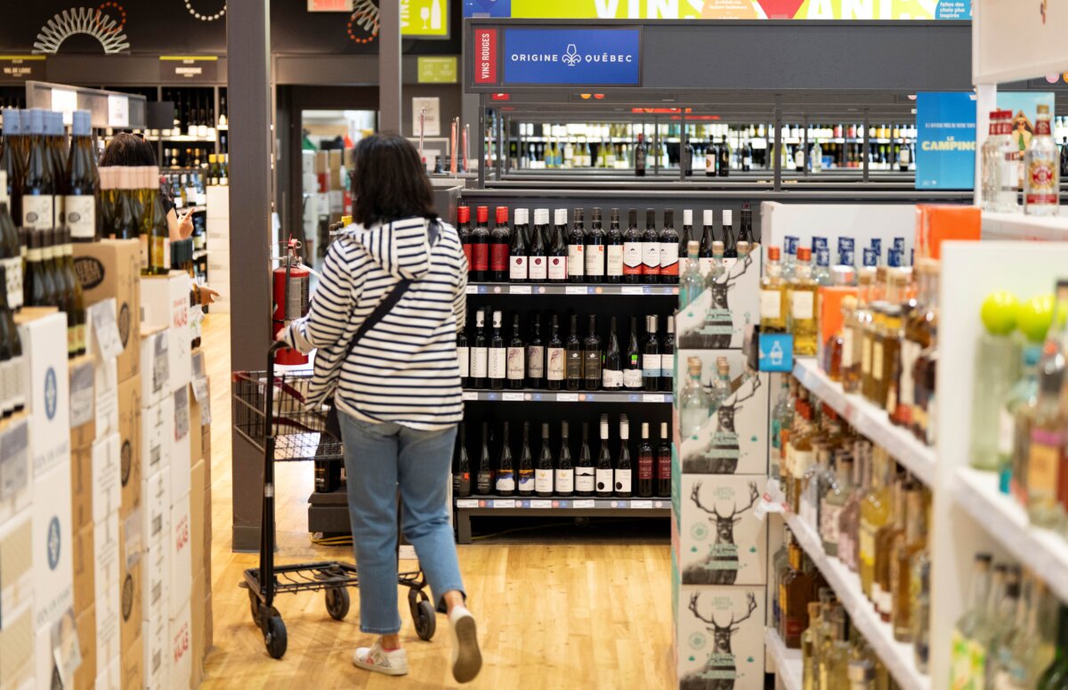 A woman shops at a liquor store in Montreal on July 22, 2026. (The Canadian Press/Christinne Muschi)