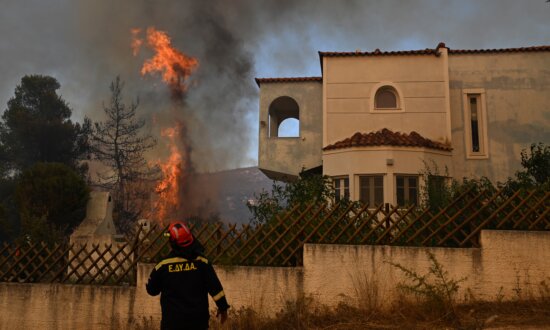 Firefighters Still Battling Fires in Greece After 2 Killed in Helicopter Collision