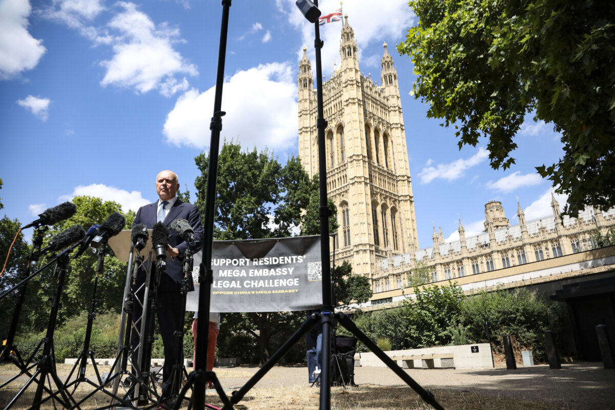 Sir Iain Duncan Smith speaks during a press conference at Victoria Tower Gardens in London, on July 31, 2026. The UK government's approval of China's "mega embassy" at Royal Mint Court in London was being challenged in the High Court through a judicial review brought by the Royal Mint Court Residents' Association (RMCRA). The core issues centre on human rights, enforcement of safety regulations and national security. (Alishia Abodunde/Getty Images)