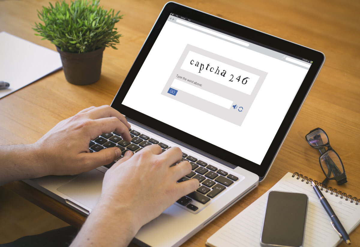 Cybercriminals are using fake CAPTCHA screens to trick people into installing malware on their own computers. (zimmytws/shutterstock)