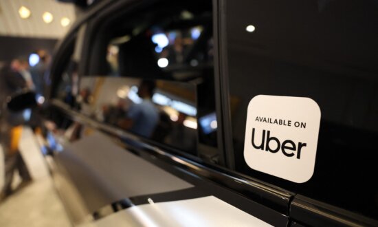 Uber Steps Up Robotaxi Race With $10 Billion Investment