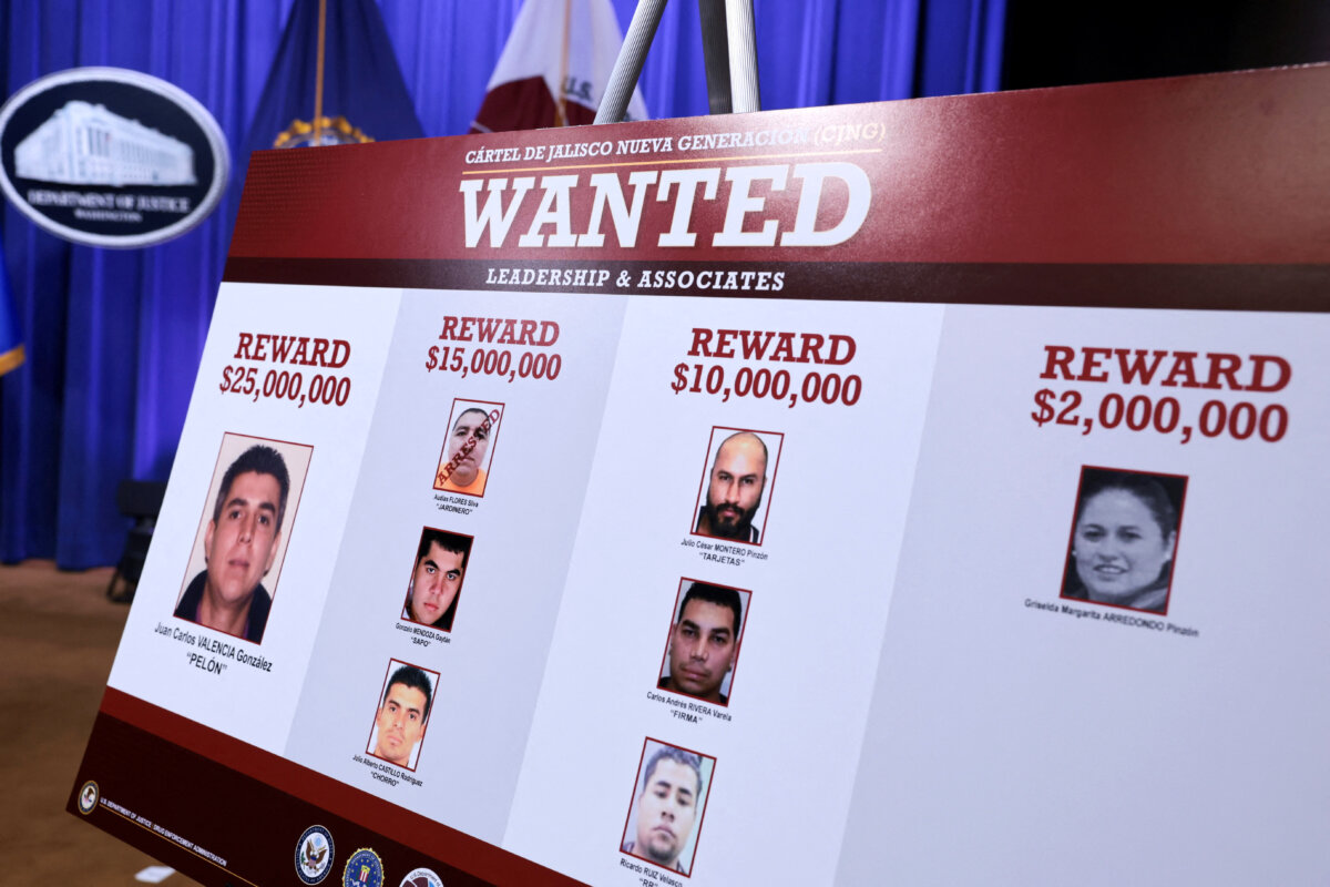 A board featuring images of wanted members of the Jalisco New Generation Cartel (CJNG) on the day of a press conference to announce new Trump administration actions against the CJNG, at the Justice Department in Washington on Aug. 5, 2026. (Jonathan Ernst/Reuters)