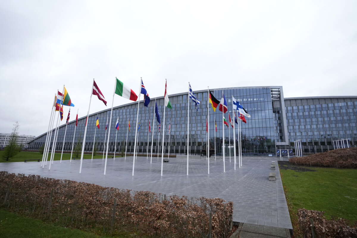 Flags of NATO member countries are seen outside the alliance’s headquarters in Brussels on April 3, 2024. (AP Photo/Virginia Mayo)