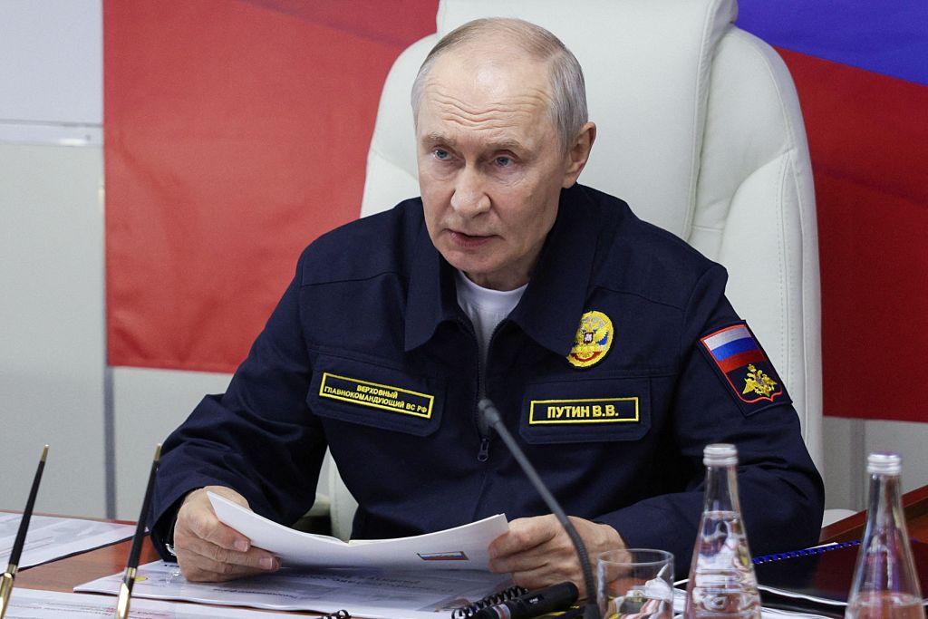 Russian President Vladimir Putin holds a meeting onboard the Russian Navy's guided missile cruiser Varyag during the final stage of a Pacific Fleet's naval drills on far eastern Sakhalin Island on August 12, 2026. (Gavriil Grigorov/AFP via Getty Images)
