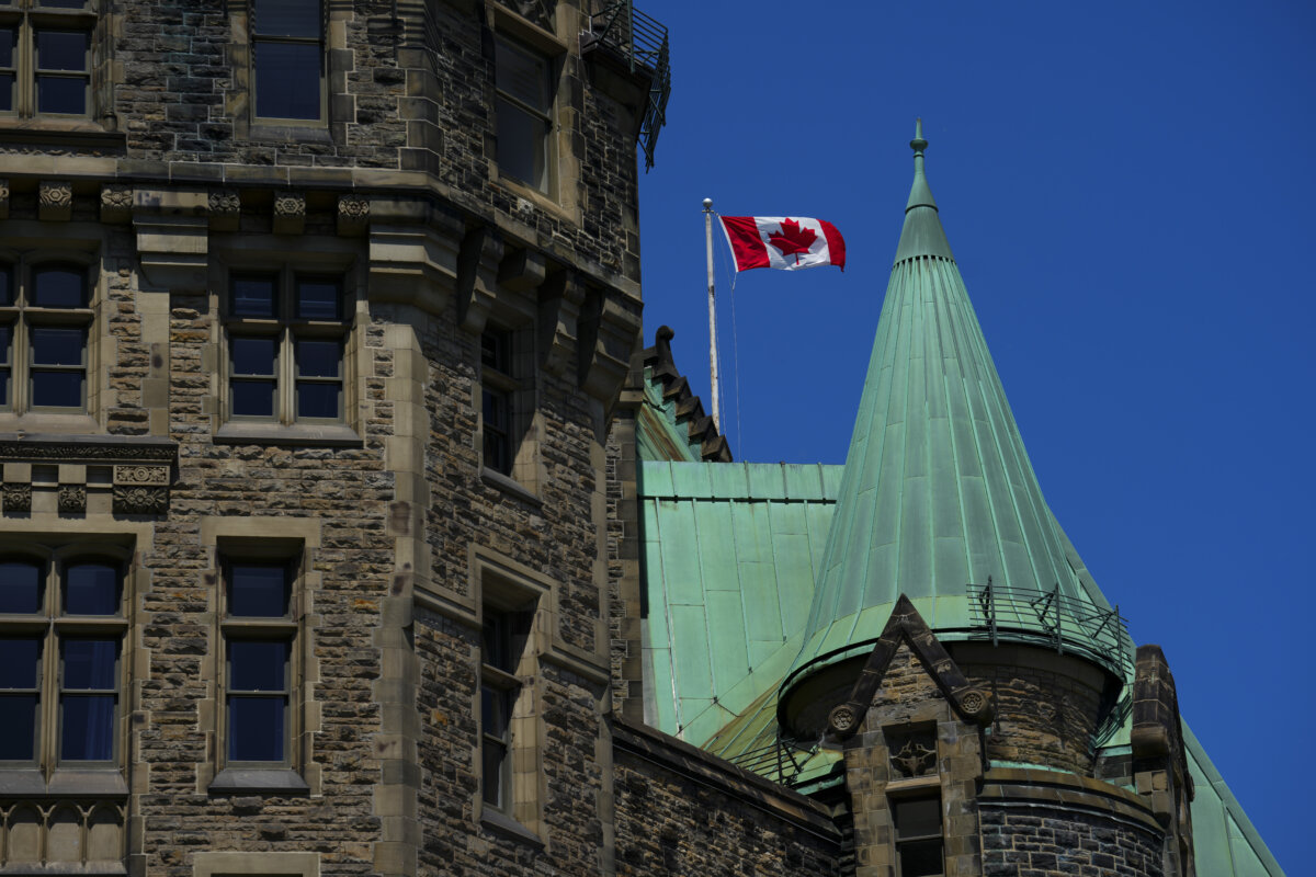 The Canadian flag blows on top of the Confederation Building on Parliament Hill in Ottawa on May 26, 2026. (The Canadian Press/Sean Kilpatrick)