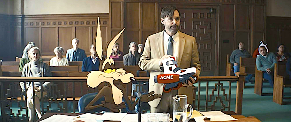 lawyer stands in courtroom with cartoon client in Lawyer Kevin Avery's (Will Forte) mobile billboard in Coyote Vs. ACME