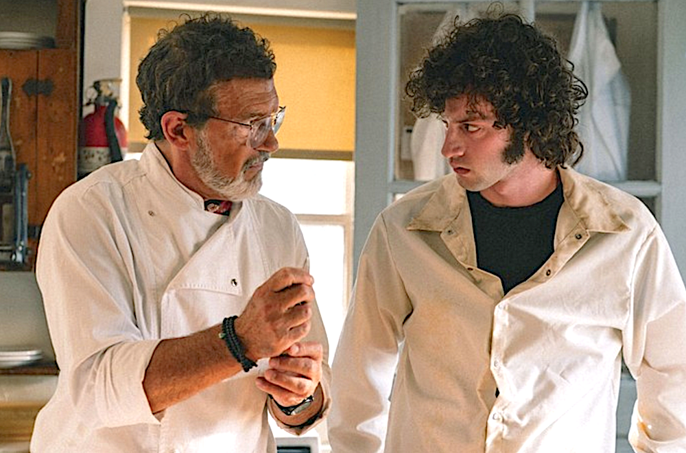 older man and younger man in chef outfits in Tony
