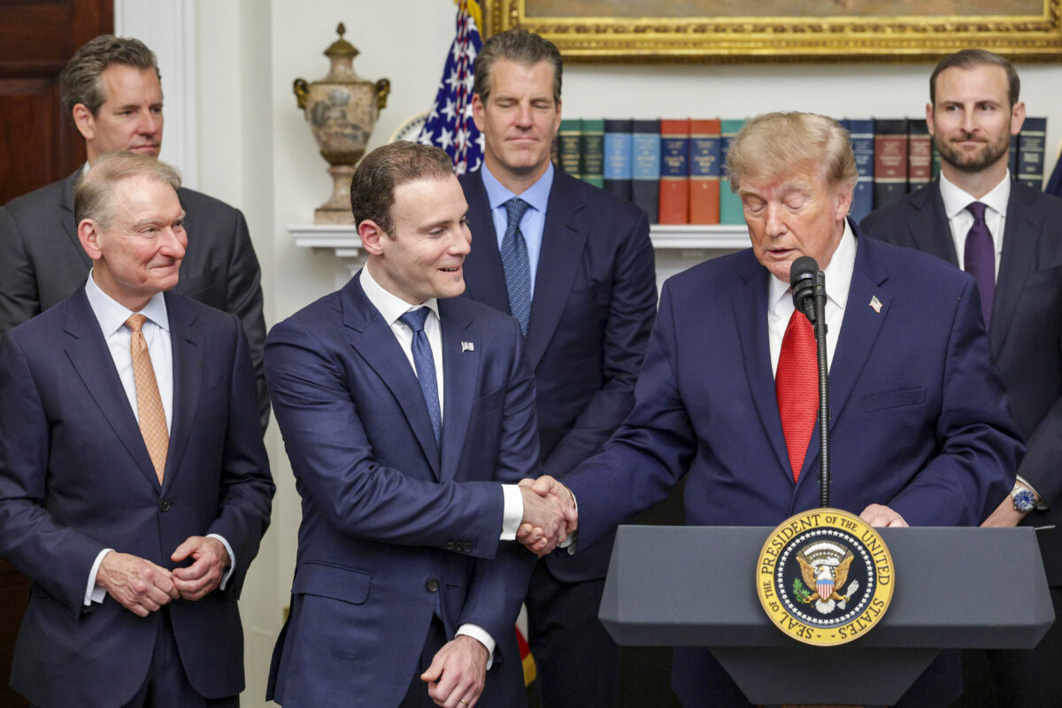 President Donald Trump shakes hands with Commodity Futures Trading Commission (CFTC) Chairman Michael Selig during a summit of crypto and technology leaders in the Roosevelt Room of the White House in Washington, on August 19, 2026. (Alex Wong/Getty Images)