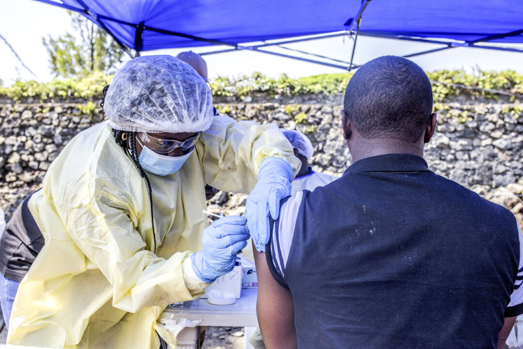 A man receives a vaccine against Ebola from a nurse outside the Afia Himbi Health Center in Goma, Congo, on July 15, 2019. (Pamela Tulizo / AFP via Getty Images)