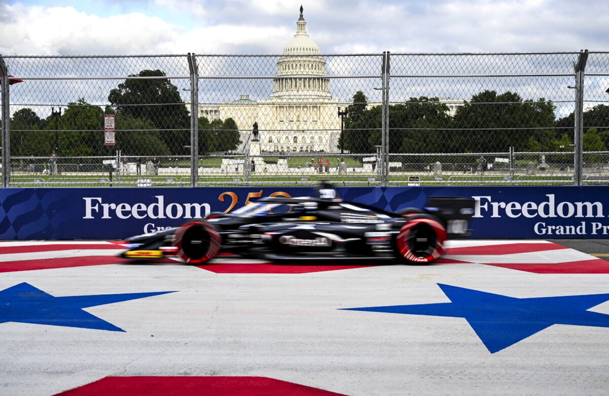 The Indy Car driven by Championship points leader Spanish driver Alex Palou, races past the Capitol Building to obtain pole position during a qualification round in Washington on Aug. 22, 2026. (Roberto Schmidt/AFP via Getty Images)