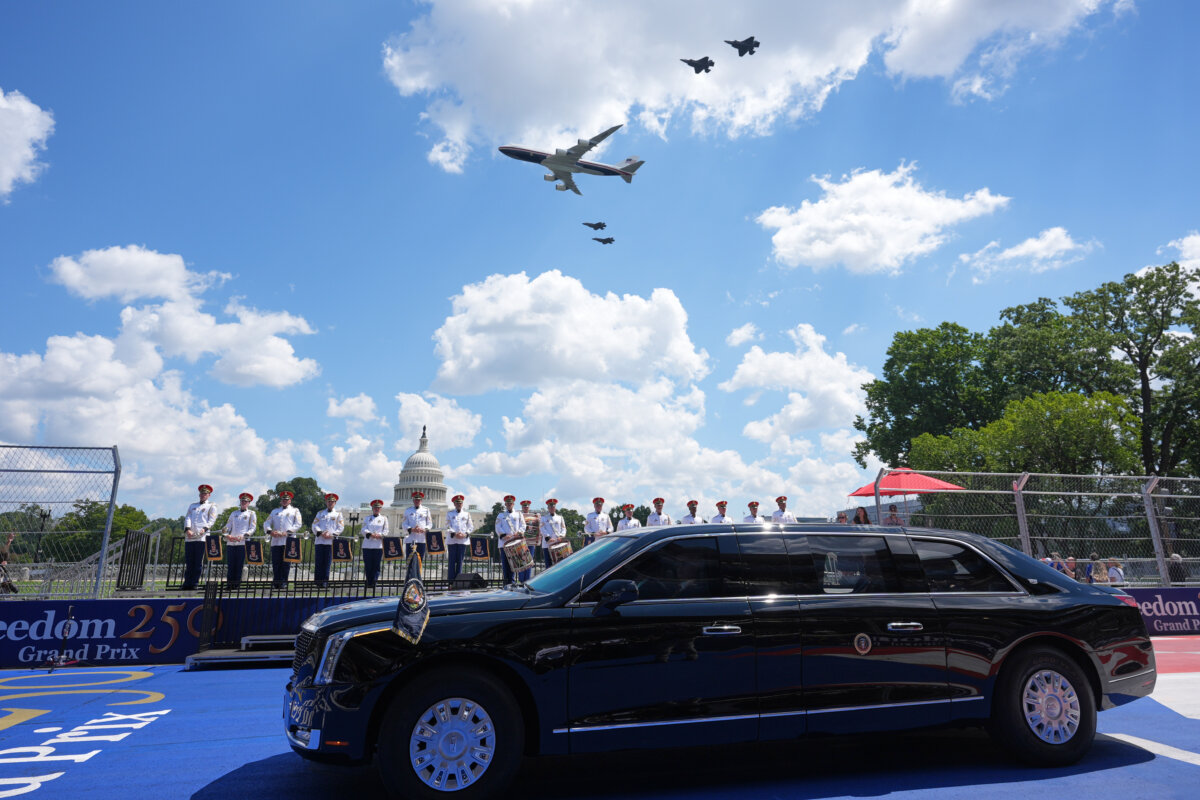 A jet used as Air Force One and four F-35s pass over as President Donald Trump, in the presidential limousine known as "The Beast," does a lap around the track before the IndyCar Freedom 250 Grand Prix auto race in Washington on Aug. 23, 2026. (AP Photo/Alex Brandon) (AP Photo/Alex Brandon)