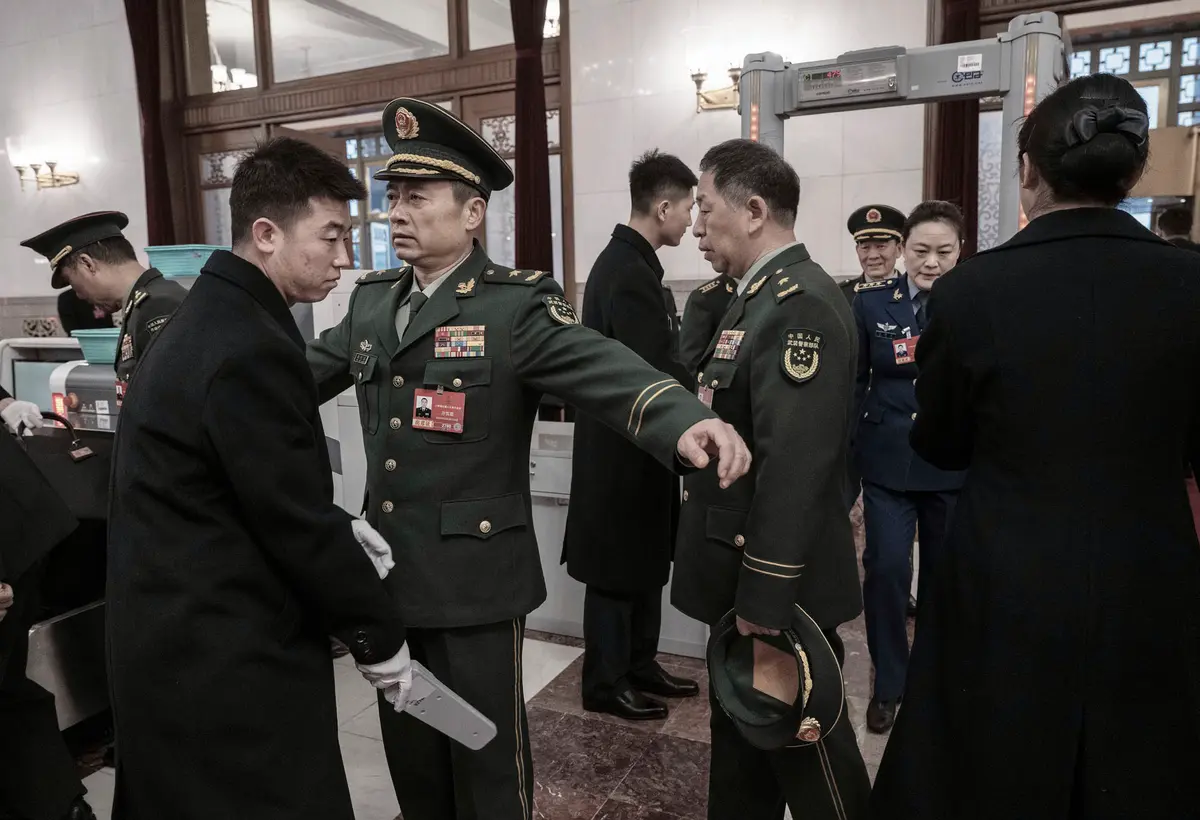 Military delegates attending the Chinese Communist Party’s National People’s Congress undergo security checks as they enter the Great Hall of the People in Beijing on March 5, 2026. (Kevin Frayer/Getty Images)