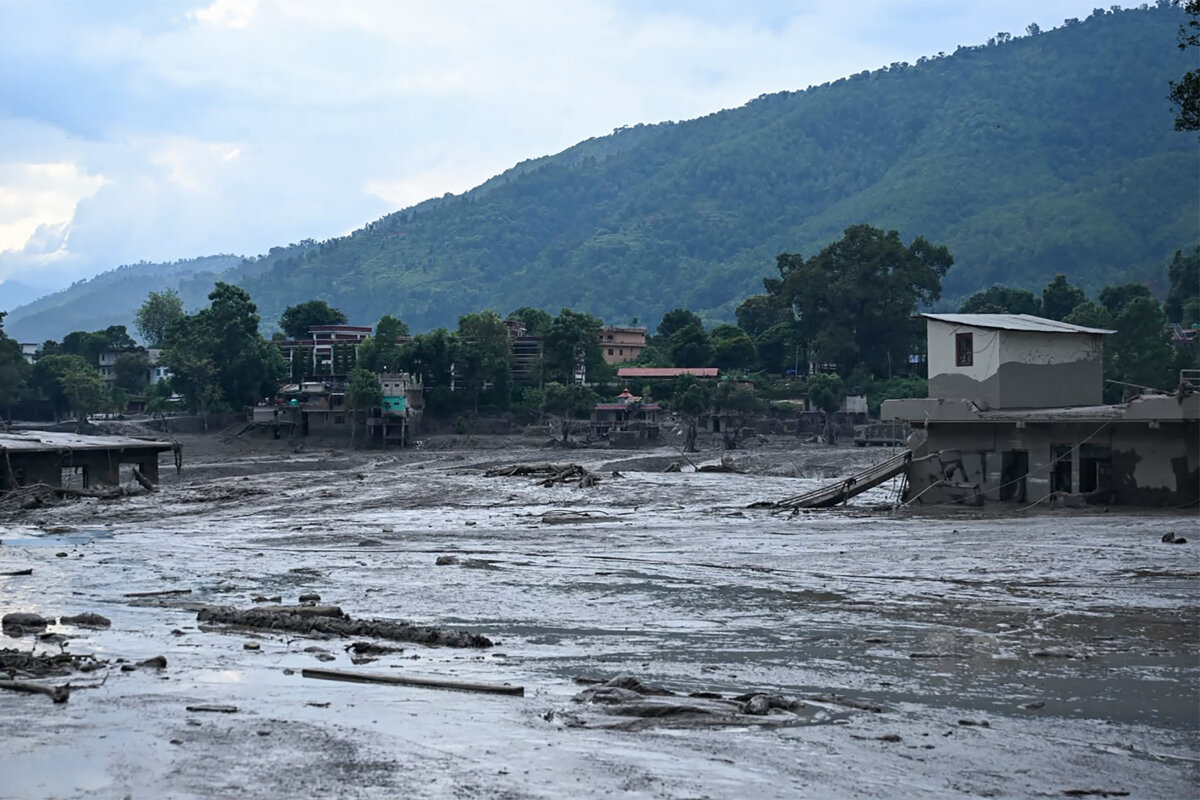 Houses lie deluged in sludge following flash floods at Devghat in Nepal's Nuwakot district on Aug. 26, 2026. (Prakash Mathema/AFP via Getty Images)