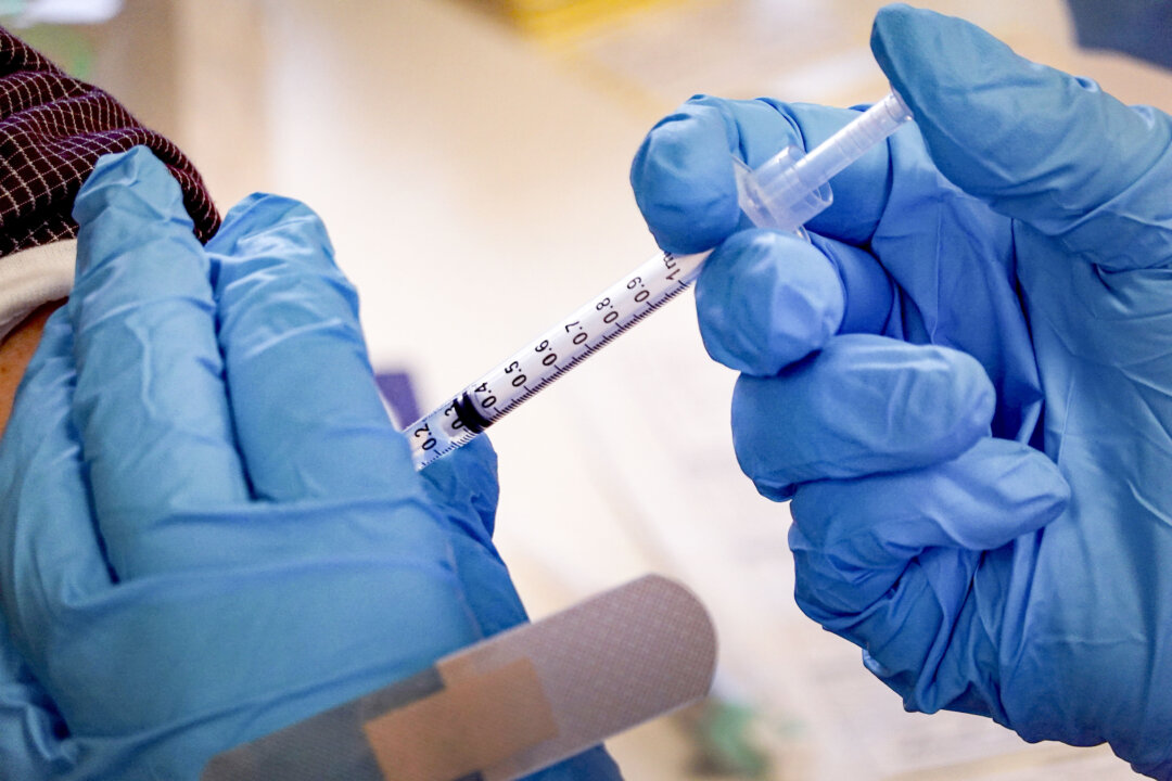 A vaccine is given in Illinois on Sept. 9, 2022. (Scott Olson/Getty Images)