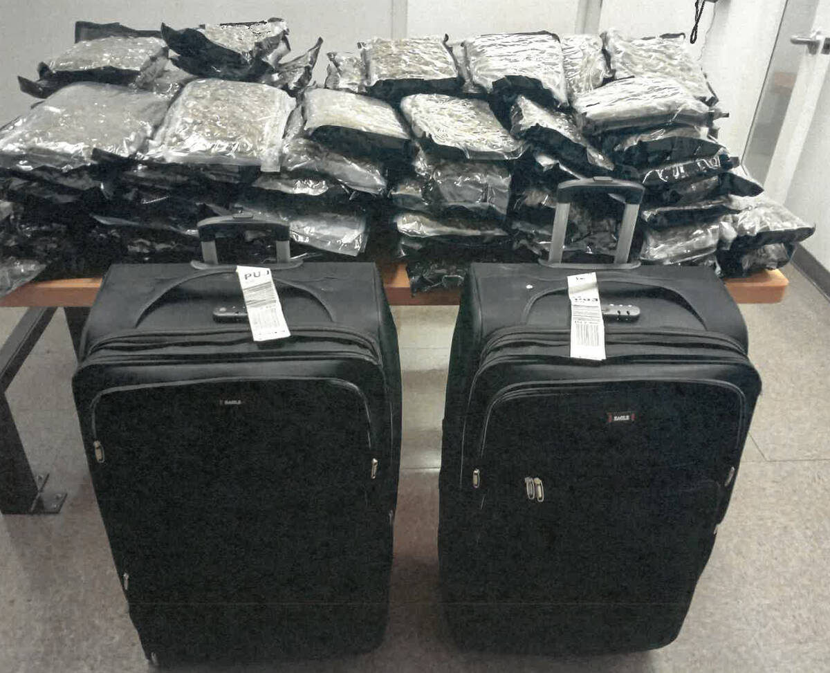 Two Air Canada employees have been arrested this week in connection with an RCMP drug trafficking investigation at Montréal-Trudeau Airport. Over the course of the probe that began in May 2026, two suitcases containing 56 kilograms of cannabis were confiscated on July 10. (RCMP handout photo)