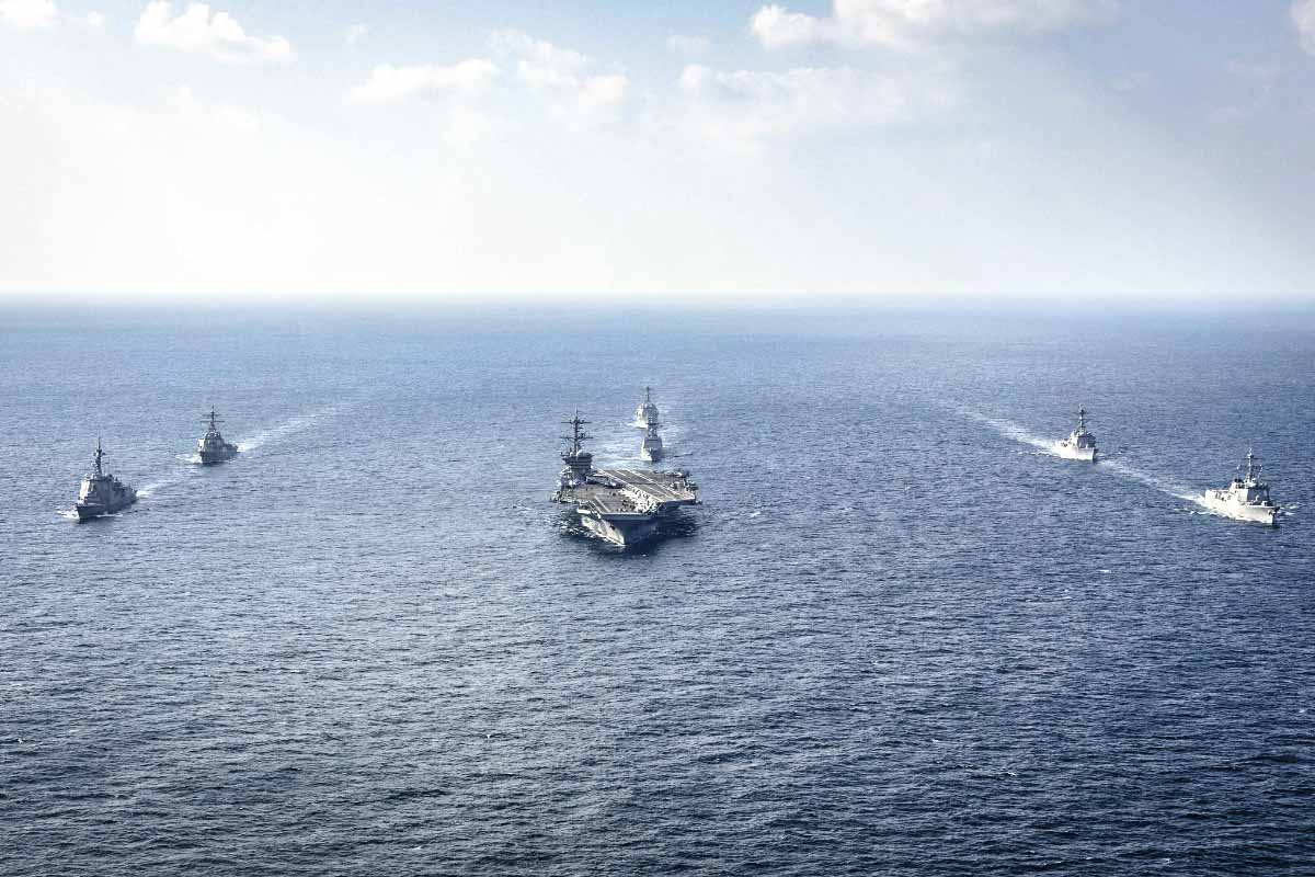 Warships of South Korea, the United States, and Japan including the USS George Washington aircraft carrier (C) take part in the trilateral Freedom Edge exercise in international waters off South Korea's southern island of Jeju, on Nov. 13, 2024. (South Korea Defense Ministry via AP)