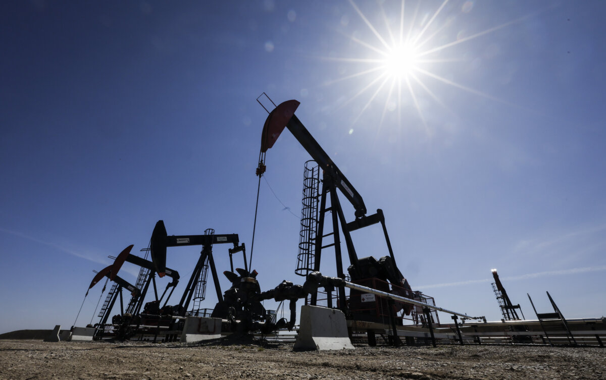 Pumpjacks draw oil and gas from a wellhead near Calgary on May 6, 2025. (The Canadian Press/Jeff McIntosh)