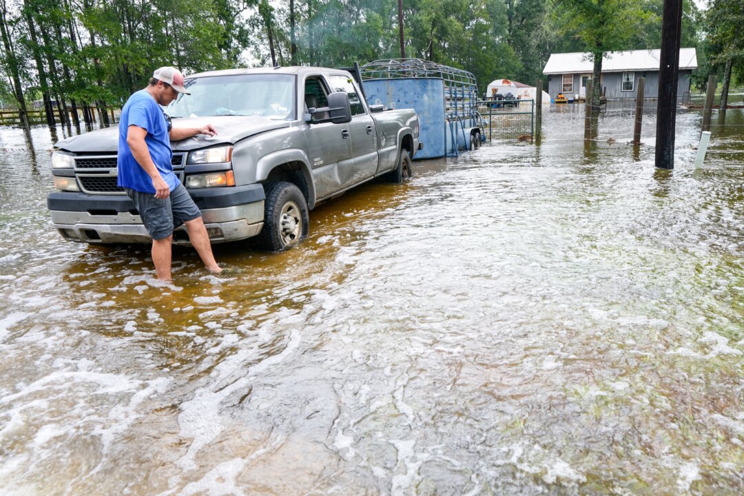 Former Tropical Storm Edouard Lingers Over Texas, Flooding Homes and Roadways