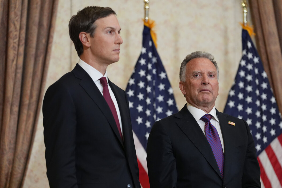 Jared Kushner (L) and Steve Witkoff (R) listen as Vice President JD Vance speaks during a news conference in Islamabad, Pakistan, on April 12, 2026. (Jacquelyn Martin/Getty Images)