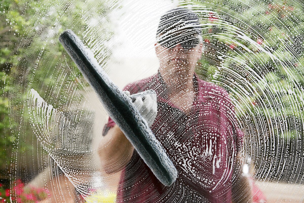 Washing them on a blazing summer day seems virtuous until the heat causes the cleaning solution to dry on the glass before you can wipe it away, leaving streaks where the dirt used to be. (mikeledray/Shutterstock)