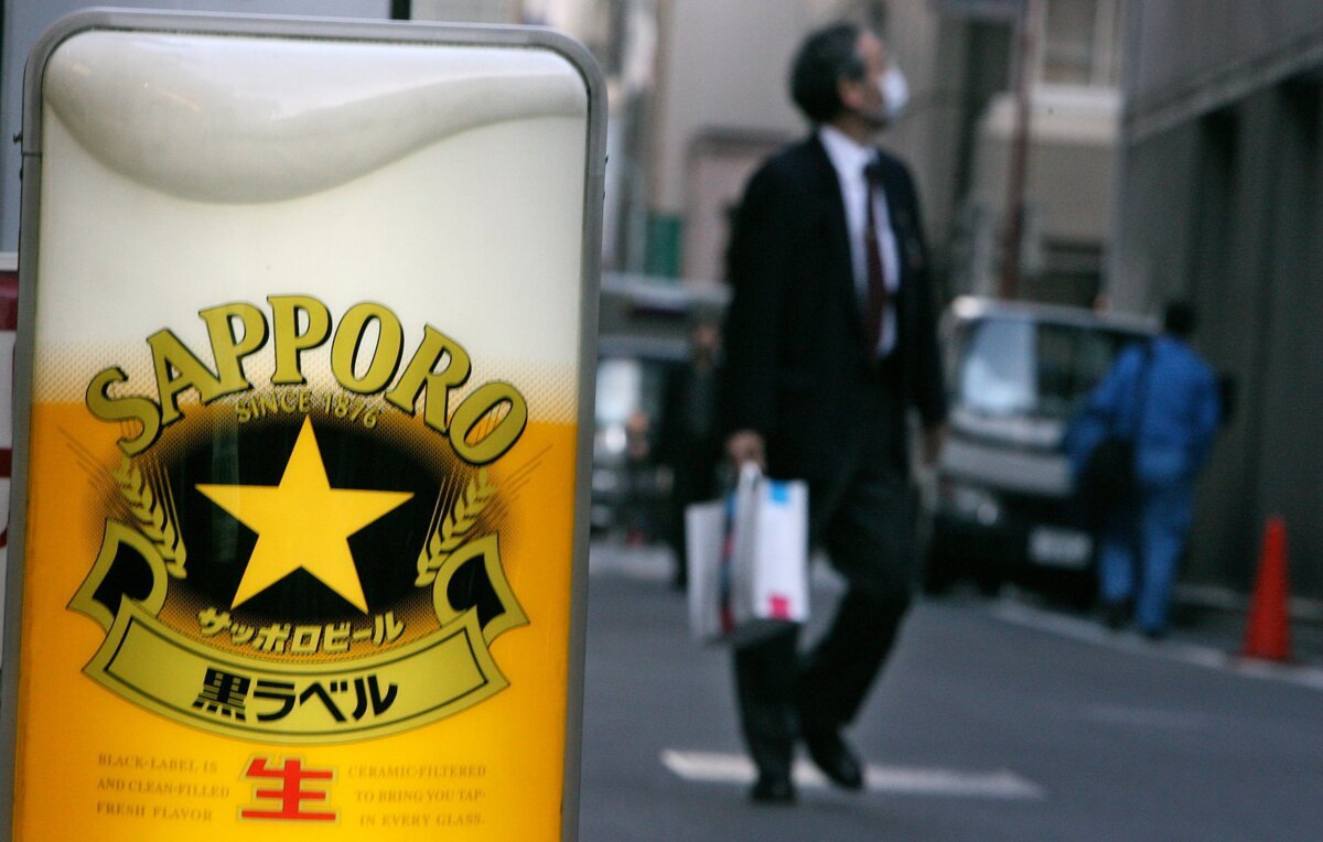 An advertisement stand for Sapporo beer is set up outside a restaurant in Tokyo on Feb. 16, 2007. (AP Photo/Junji Kurokawa)