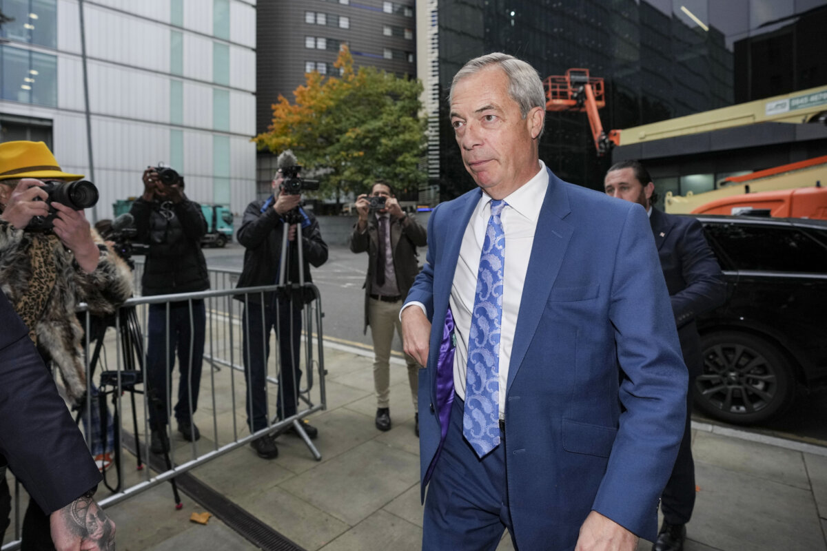 Britain's Reform UK leader Nigel Farage arrives at Southwark Crown Court in London, Tuesday, Oct. 14, 2025, for the sentencing of a man who made a threat to kill the Reform UK leader. (AP Photo/Kin Cheung)