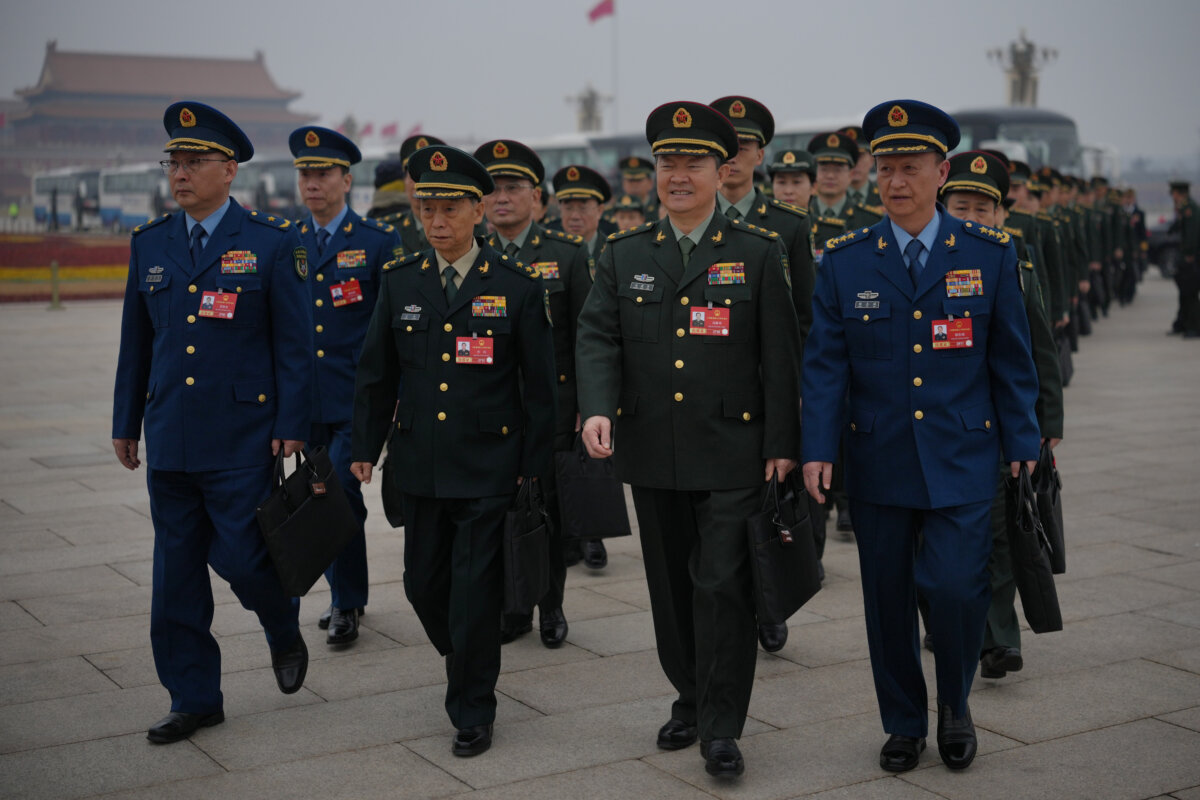 Military delegates arrive for the pre-session of the National People's Congress at the Great Hall of the People in Beijing on March 4, 2026. (Andy Wong/AP Photo)