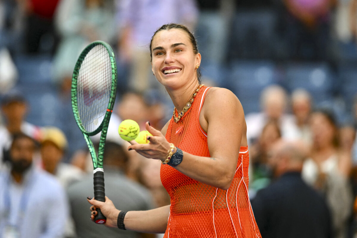 Belarus's Aryna Sabalenka hits balls to the crowd after defeating Czech Republic's Linda Noskova in their women's singles quarterfinal tennis match on day ten of the U.S. Open tennis tournament at the USTA Billie Jean King National Tennis Center in New York City on Sept. 8, 2026. (Angela Weiss/AFP via Getty Images)