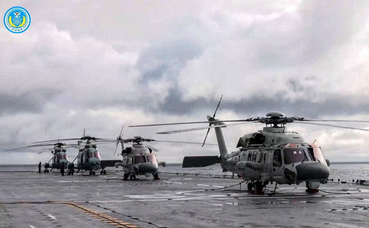Helicopters on an amphibious assault ship take part in military drills in waters southeast of Taiwan, in this screenshot from a video released by the Eastern Theatre Command of China's People's Liberation Army on Dec. 29, 2025. (Eastern Theatre Command/Handout via Reuters)
