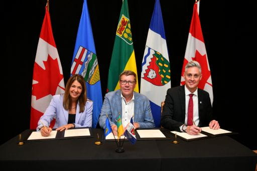 Alberta Premier Danielle Smith, Saskatchewan Premier Scott Moe, and Northwest Territories Premier R.J. Simpson sign a memorandum of understanding (MOU) on Sept. 14, 2026, in Saskatchewan aiming to advance grid reliability, and nuclear energy among the three regions. (Handout photo)