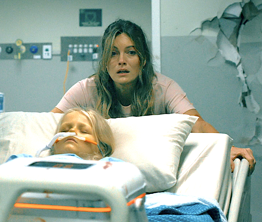 Mother pushing her daughter's hospital bed in Runner